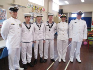 Chief Petty Officer, Shaun Logan with some of the Cadets of the TS Bendigo and Naval Chaplain, Rev Miles Fagan